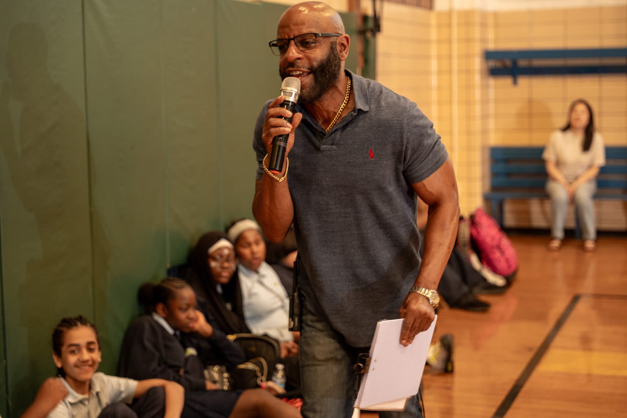 An FLI school assembly, students and staff gathered together.